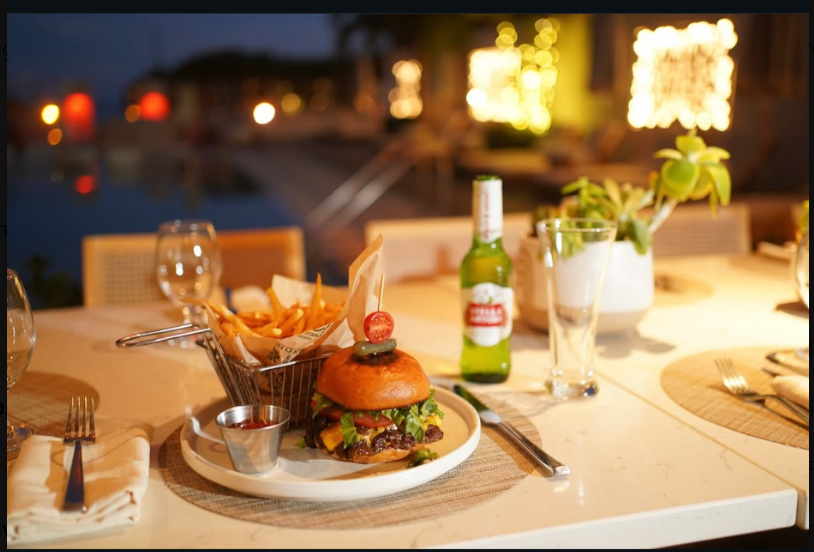 Burger and fries with a Stella Artois beer at Kalypso Beach
